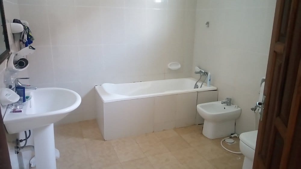 Modern bathroom with walk-in shower and sea view